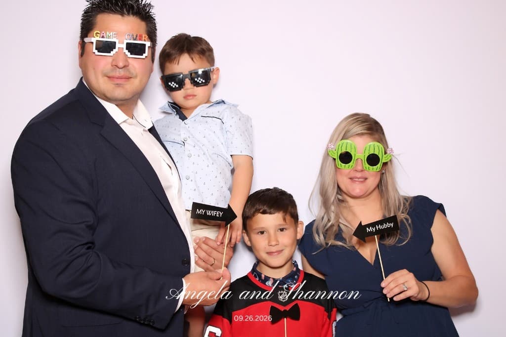 Wedding family portrait with playful booth props